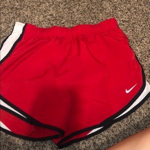 Red Nike running shorts